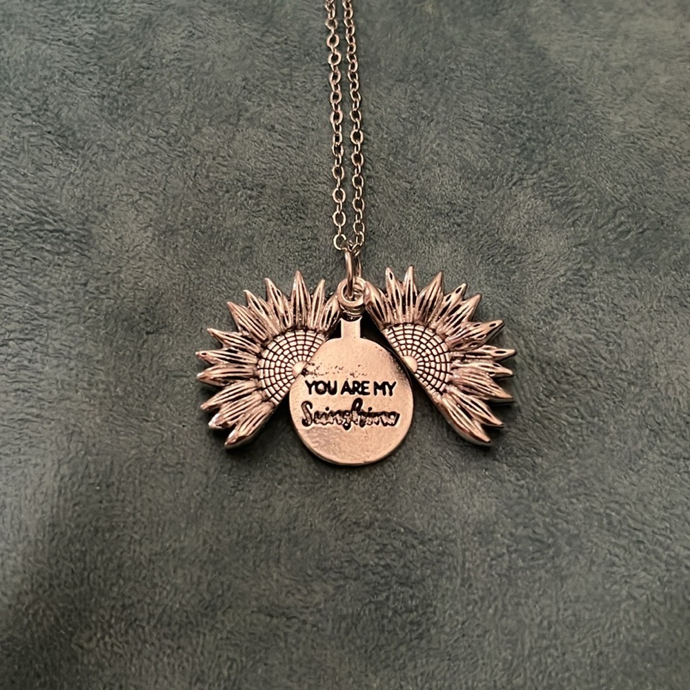 Silver sunflower secret message necklace